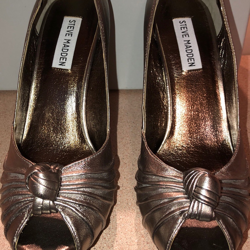 Shinning silver SteveMadden shoe.